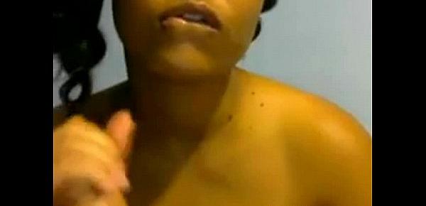  Ebony babe sucks dildo on webcam